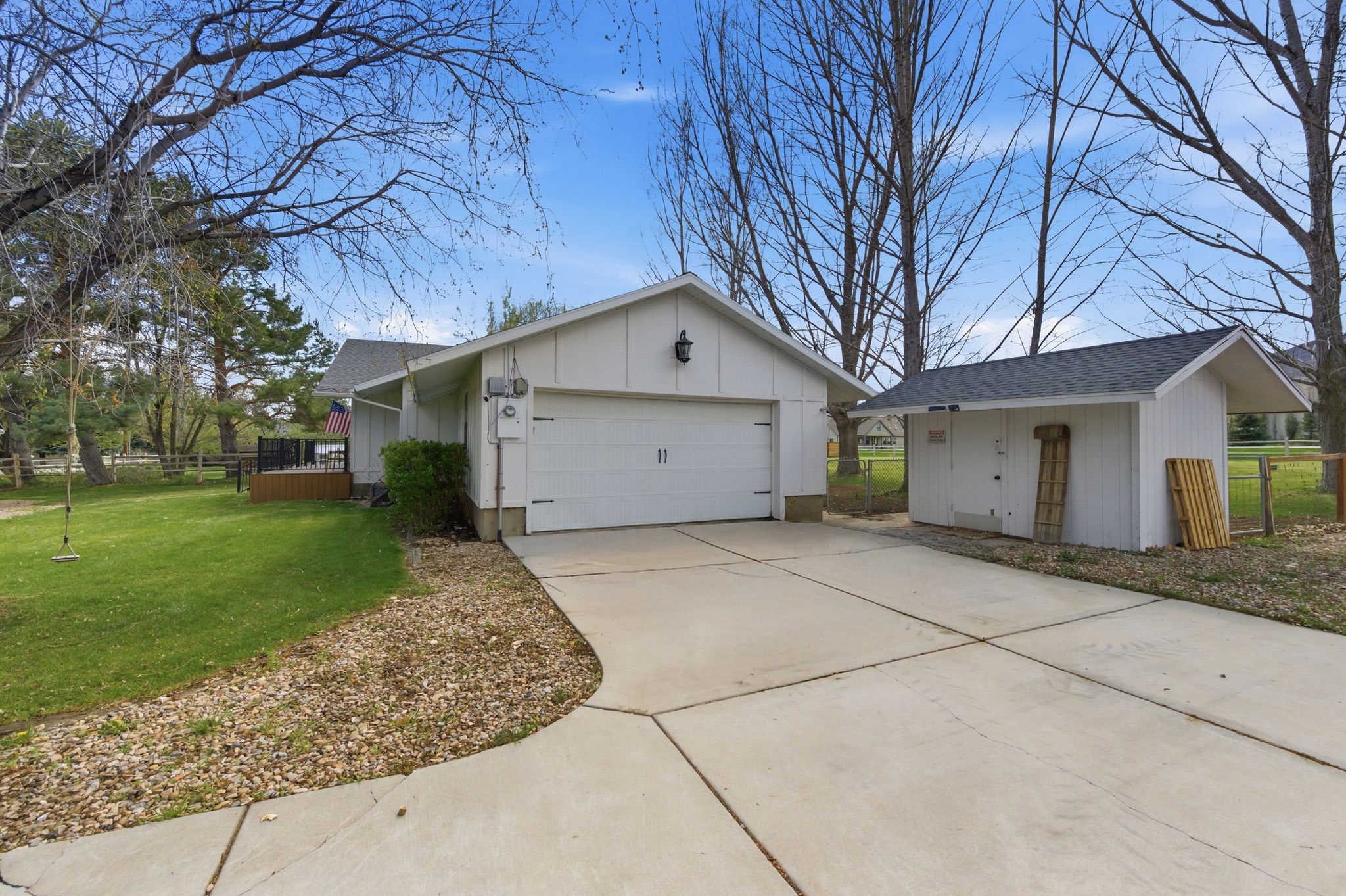 Side view of the home with attached garage and driveway